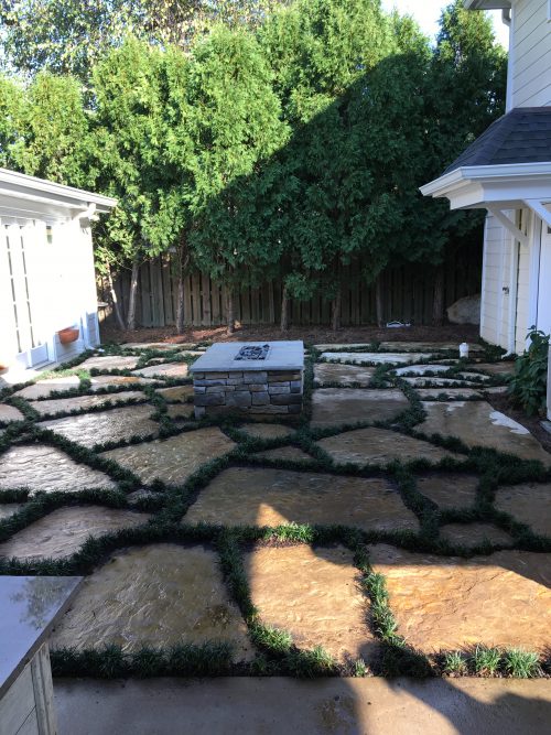 Flagstone Slab Patio with Mondo Grass and Fire Pit